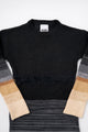 Close-up of Suss knit dress showing textured black and gray variegated knit pattern