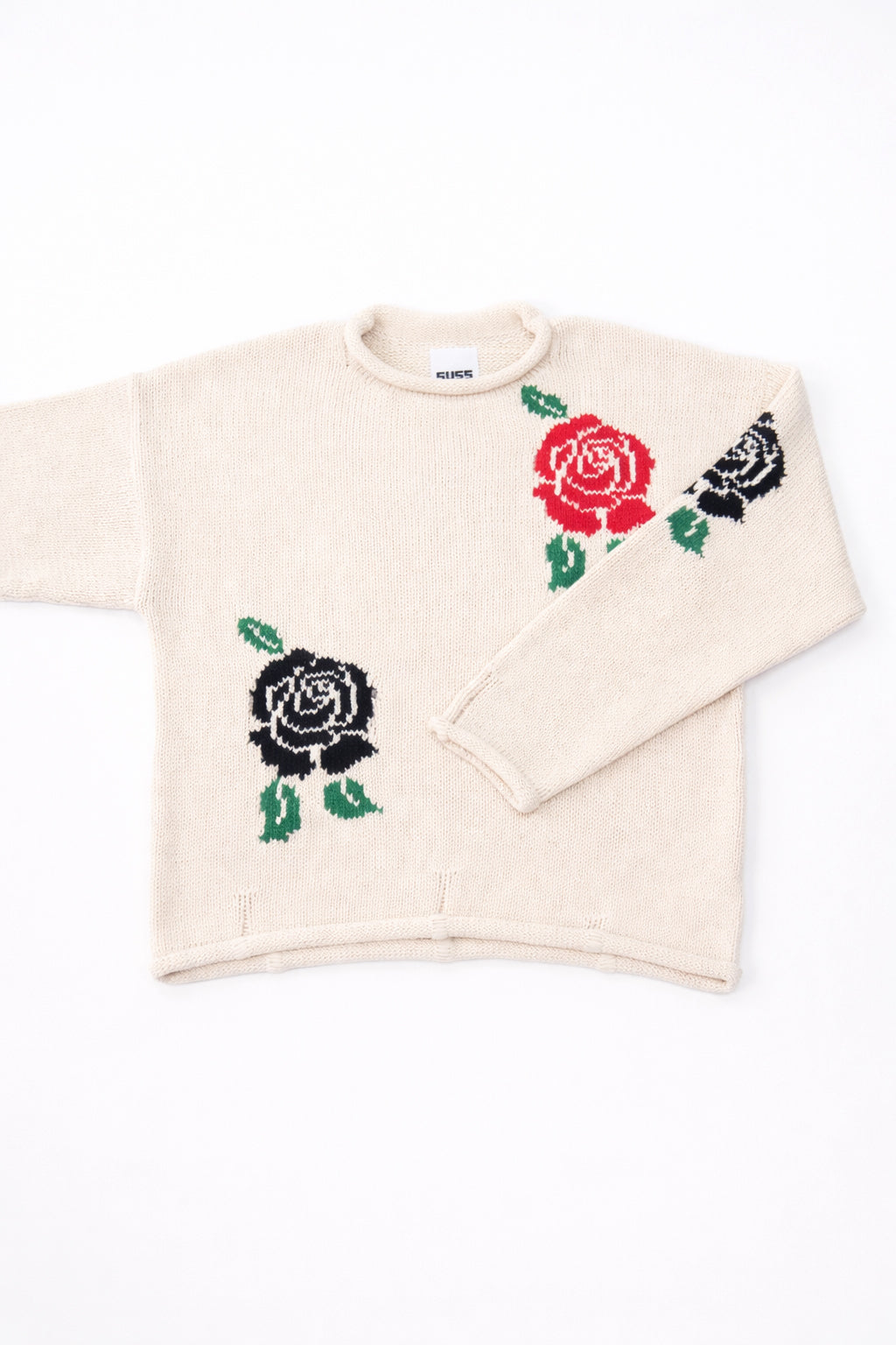 Front flat lay detail of the Suss cream recycled cotton hand loomed sweater emphasizing the armhole.