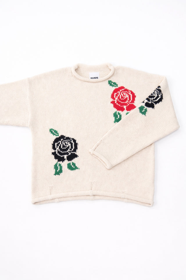 Front flat lay detail of the Suss cream recycled cotton hand loomed sweater emphasizing the armhole.