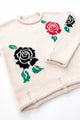 Hem detail with drop stitches of the Suss rose rollneck sweater hand loomed in recycled cotton