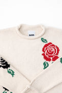 Neckline detail of the Suss rose intarsia rollneck swedater hand loomed in cream recycled cotton