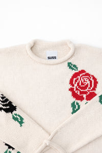 Neckline detail of the Suss rose intarsia rollneck swedater hand loomed in cream recycled cotton