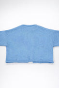 Back view of baby blue cotton cropped knit jacket by Suss Knits