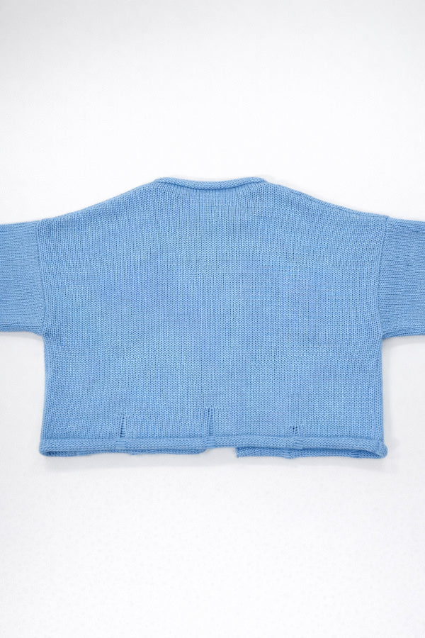 Back view of baby blue cotton cropped knit jacket by Suss Knits