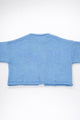 Back view of baby blue cotton cropped knit jacket by Suss Knits
