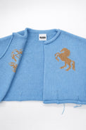 Interior knit detail of baby blue cotton cropped jacket by Suss Knits