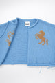 Interior knit detail of baby blue cotton cropped jacket by Suss Knits