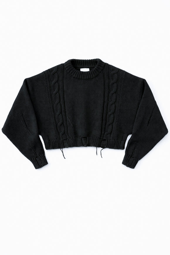 Charcoal black cropped cable knit sweater with distressed hem, chunky hand loomed cotton wool blend knit