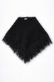 Black fuzzy knit fringe poncho in cotton and viscose by Suss Knits