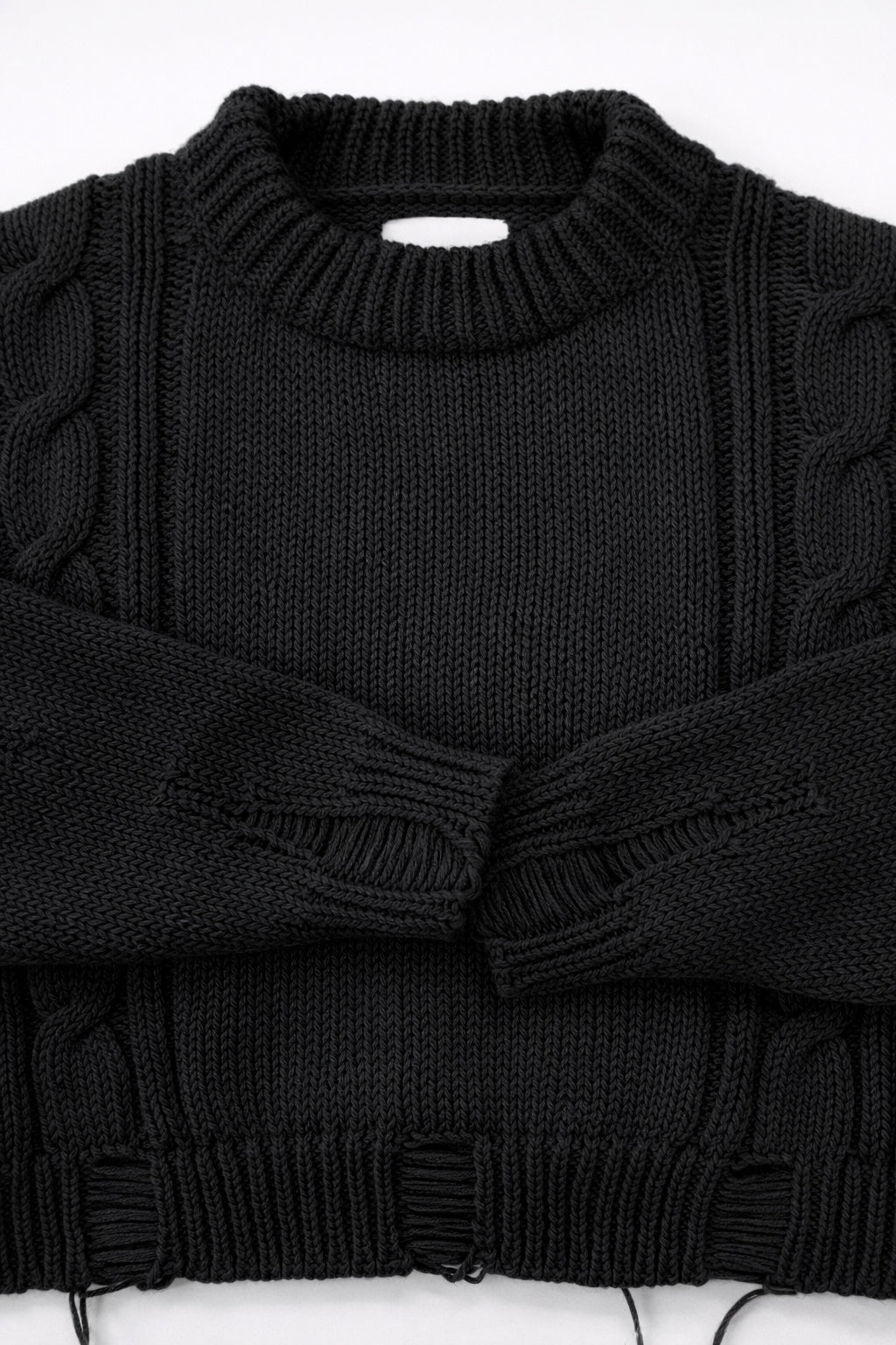 Ribbed crewneck and cuff detail on soft chunky black cotton wool blend sweater