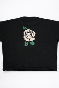 Back of black cotton knit sweater with white rose intarsia design by Suss Knits