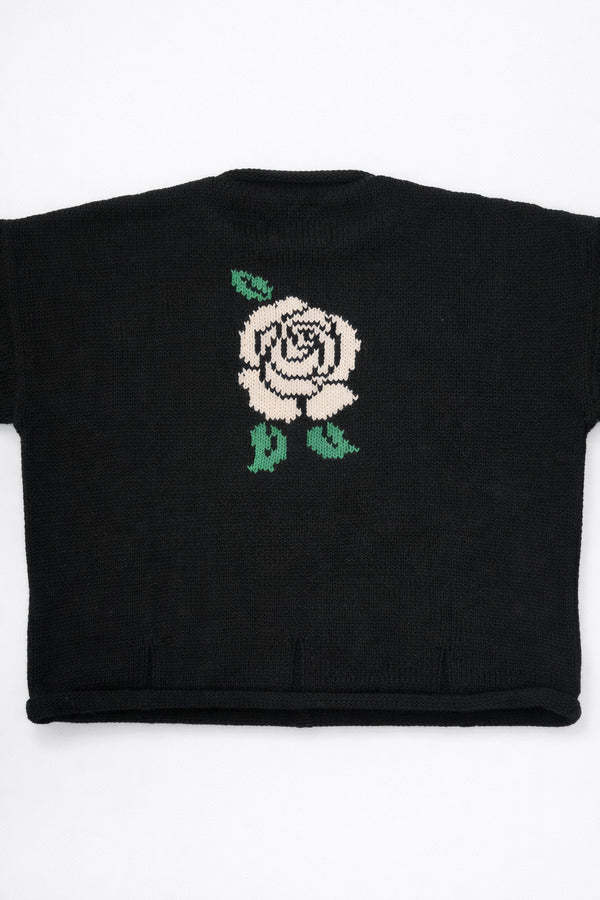 Back of black cotton knit sweater with white rose intarsia design by Suss Knits