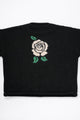 Back of black cotton knit sweater with white rose intarsia design by Suss Knits