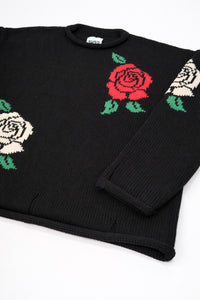 Angle flat lay detail of black cotton knit sweater with rose design by Suss Knits