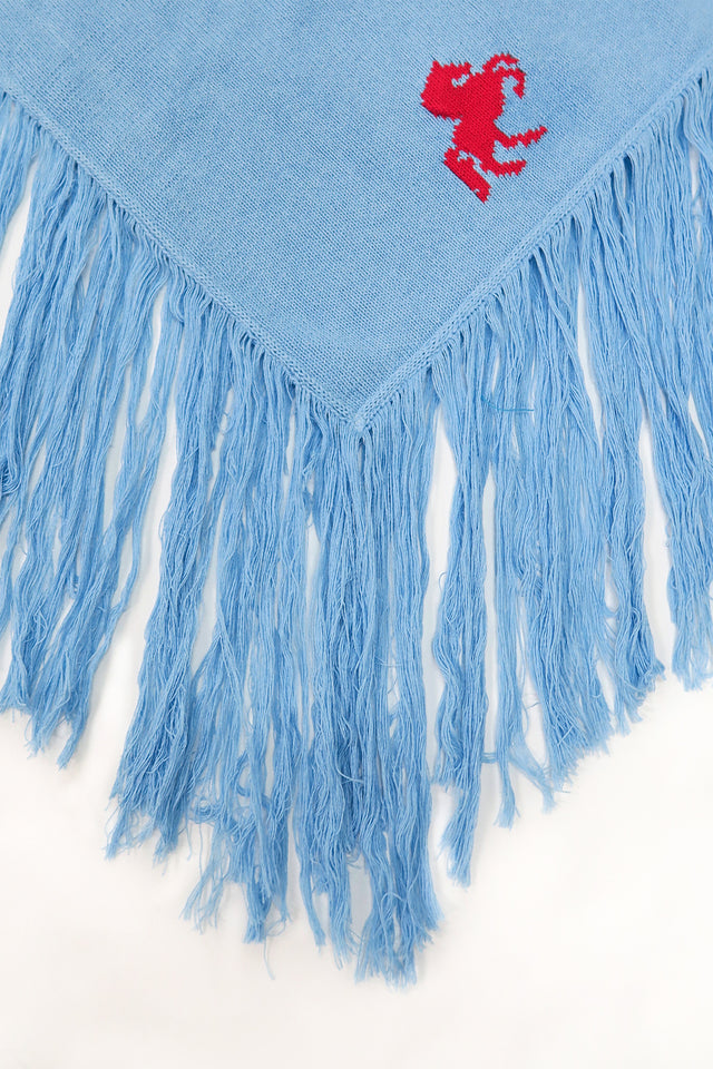 Exaggerated fringe detail on recycled cotton poncho with soft textured movement
