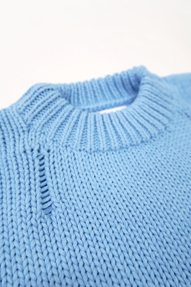 Chunky 2x1 ribbed crewneck detail on oversized blue knit sweater