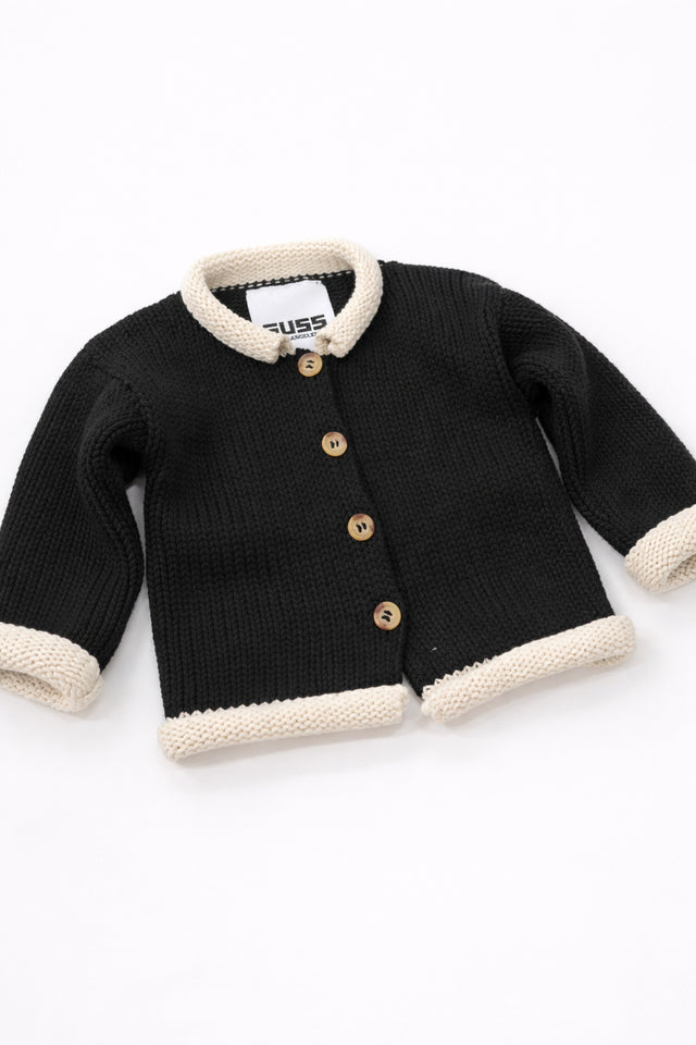 Angled view of cotton black baby knit cardigan showing texture and stitch detail