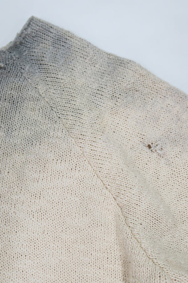 Close up of raglan sleeve detail full fashioned with small tattering.