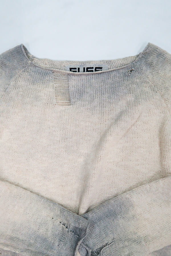 Neckline detail of the suss knits archive finish raglan sweater with drop stitch detail.