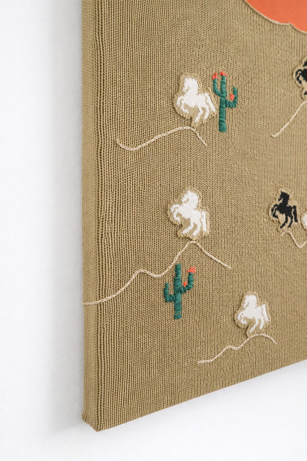 suss knits left angle detail of hand loomed horse appliqués sewn onto knit textile panel