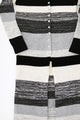 Close-up of hand-sewn shell buttons on striped knit duster cardigan in recycled cotton