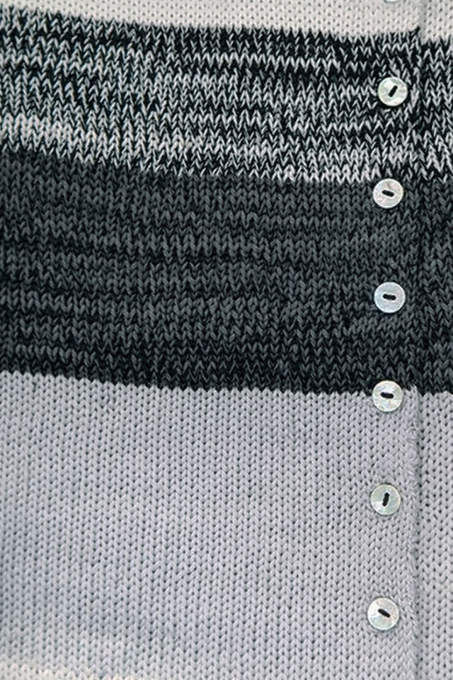 Close-up of hand-sewn shell buttons and tweedy texture on striped knit duster cardigan in recycled cotton