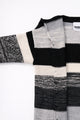 Detail of sleeve and armhole construction on hand-loomed striped cardigan with raw edge finish