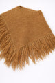 Camel fuzzy knit poncho with fringe shown at an angle by Suss Knits