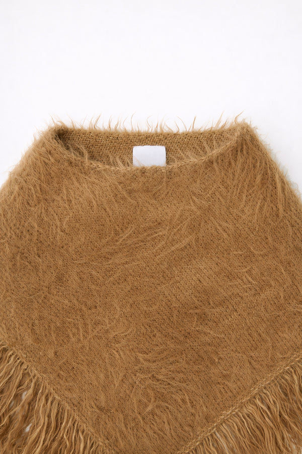Close-up of neckline and fuzzy knit texture on camel poncho by Suss Knits
