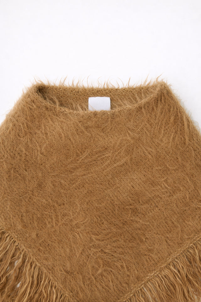 Close-up of neckline and fuzzy knit texture on camel poncho by Suss Knits