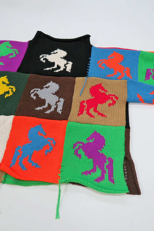 Angle back view of one-of-a-kind patchwork horse knit sweater