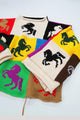 Angled front view of colorful horse intarsia patchwork sweater