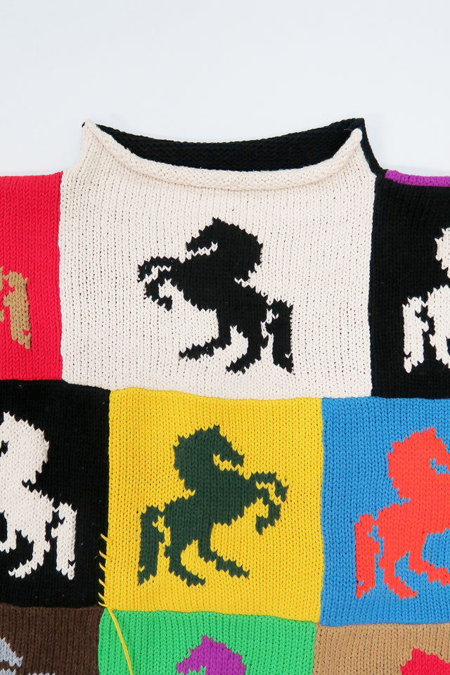 Close-up of mini mock neck on handmade patchwork knit sweater