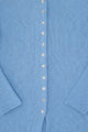 Close-up of shell buttons on light blue recycled cotton knit duster