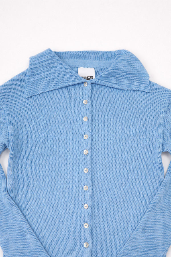 Hand loomed knit collar detail on light denim blue duster cardigan
