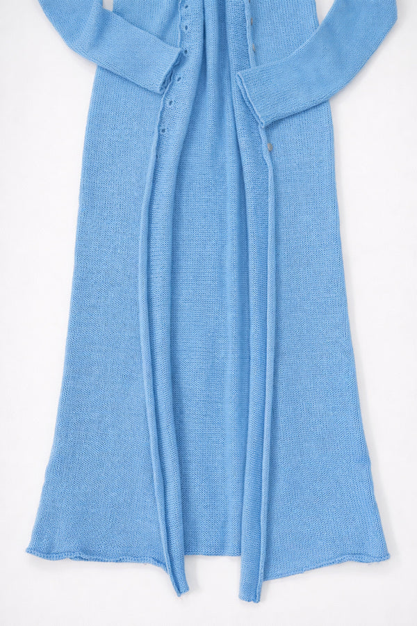 Raw edge hem detail on long blue knit duster open front