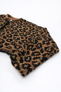 Angled view of leopard knit cardigan highlighting texture and silhouette