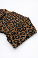 Angled view of leopard knit cardigan highlighting texture and silhouette