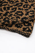 Close-up of tweedy cotton knit texture with black leopard pattern