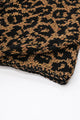 Close-up of tweedy cotton knit texture with black leopard pattern