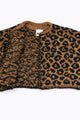 Close-up of leopard knit cardigan neckline with open front showing interior texture