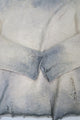 Hand dyed and tattered detail of the archive finish sweater cuff detail.