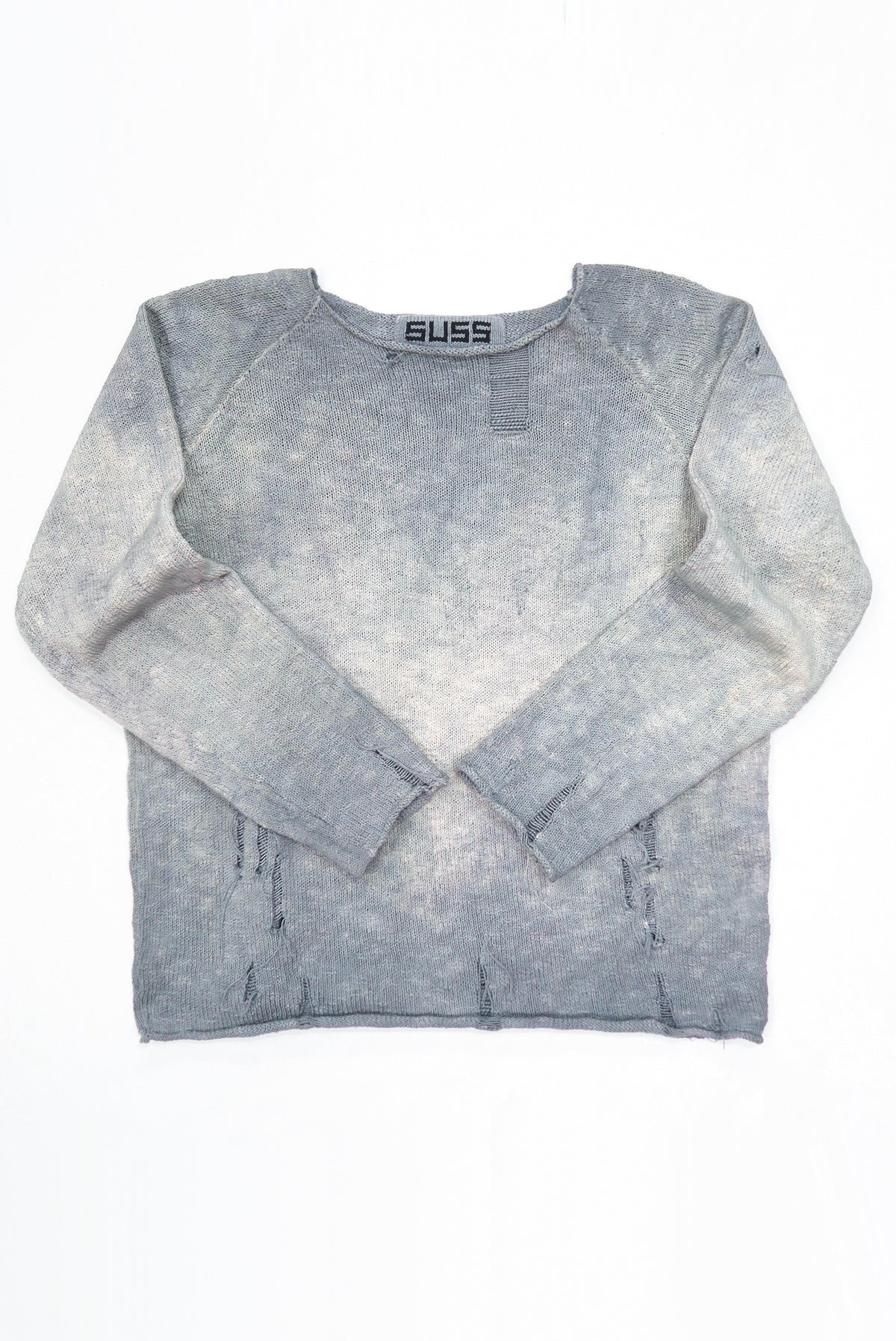 Front flat lay photo of the suss knits distressed finish archive sweater that is hand dyed in grey tones and knit in a cotton slub yarn.