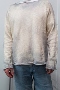 Male model in the Matrix inspired sweater knit in 100% cotton and finished with tattering and hand dye techniques.