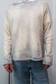 Male model in the Matrix inspired sweater knit in 100% cotton and finished with tattering and hand dye techniques.