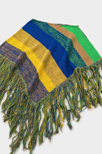 Angled view of striped hand loomed poncho with fringe detail in recycled cotton