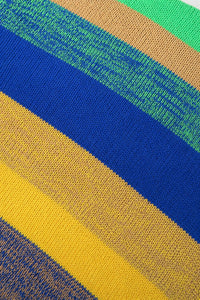 Close up detail view of striped hand loomed poncho bright colorway