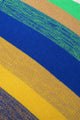 Close up detail view of striped hand loomed poncho bright colorway