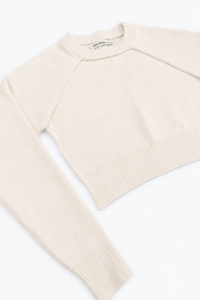 Cream Open Raglan Knit Top angled flat lay showing ribbed hem and cuff knit in cotton and lycra