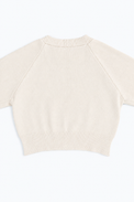 The Suss Knits Cream Open Raglan Knit Top detail shot of back panel with ribbed hem knit in cotton and lycra
